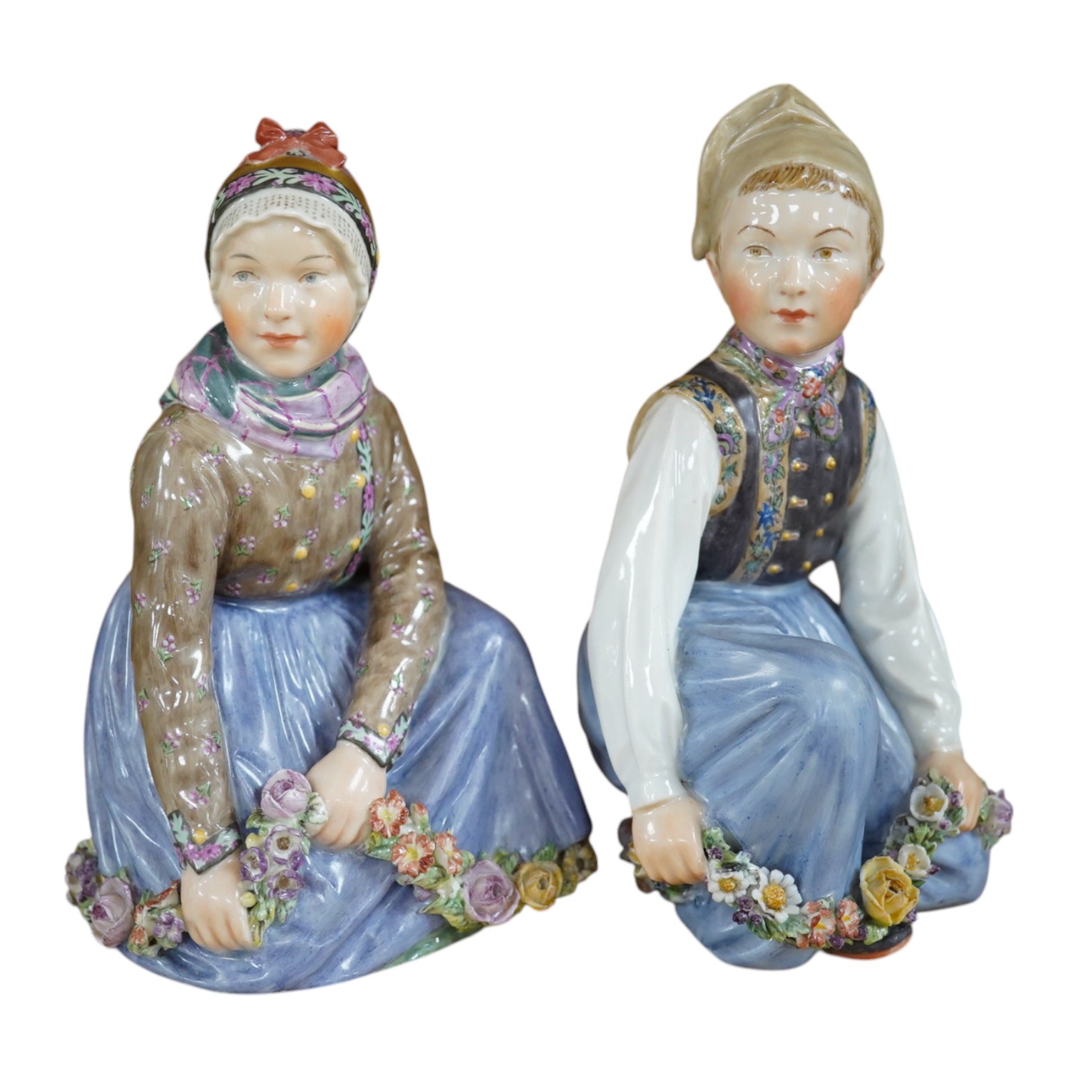 Two Royal Copenhagen figures of girls wearing national costume, Amager boy, model 12414 and Fano girl, model 12413, bases drilled, 14cm. Condition - fair to good